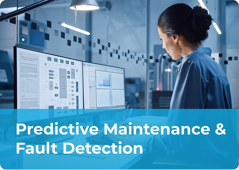 Engineer analyzing equipment data on dual monitors for predictive maintenance and fault detection in equipment manufacturing.
